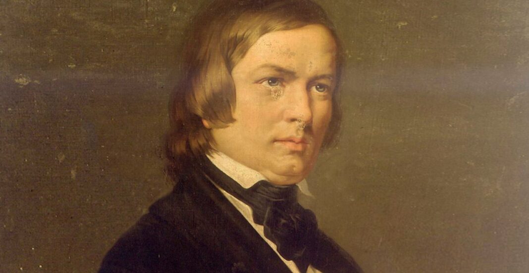 Partitura o retrato de Robert Schumann, compositor alemán del Romanticismo.