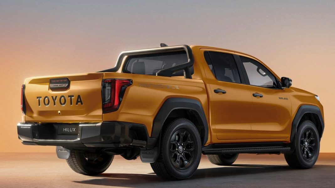 Fotografía frontal de la nueva Toyota Hilux 2026, color gris, en un entorno exterior.