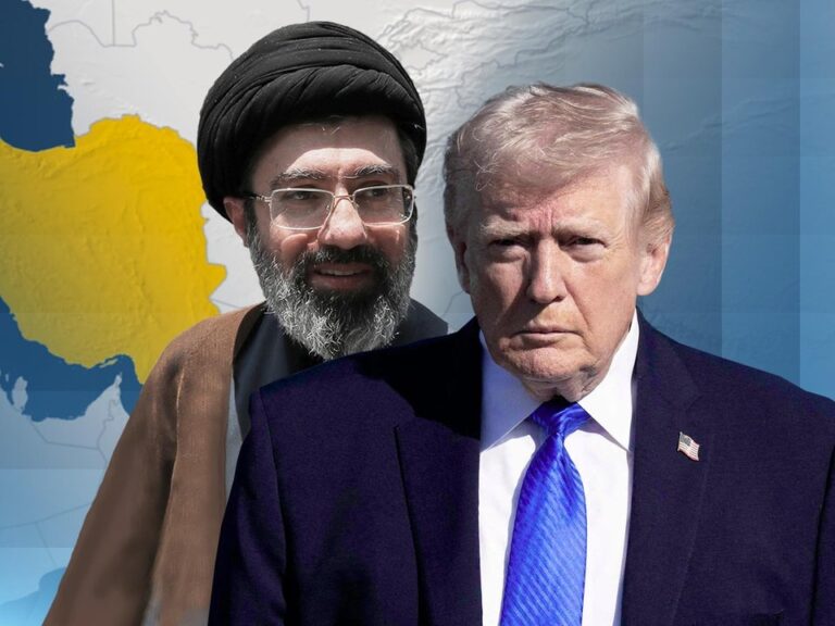 Bandera de Estados Unidos y de Irán sobre una mesa de negociaciones